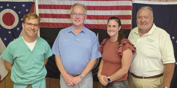 Perrysburg Township elected officials memorialize the last regular meeting of the board of trustees in the 1960s era building on Lime City Road. Future meetings will be held in the newly-constructed administration building located immediately south of the old building. From left: Trustee Jeffrey Moore, Trustee Bob Mack, Fiscal Officer Gretchen Welch and Trustee Joe Schaller.