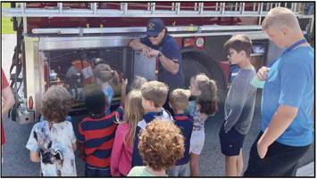 Rossford Fire Department participated in this years Safety Town, above, kindergarteners learn about the workings of a fire truck.