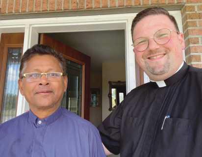 Father Antony Britto, left, and Father Scott Woods, pastor, are the new priests serving at All Saints Catholic Church.