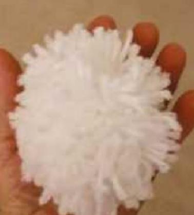 Making pompom snowballs for active, indoor fun