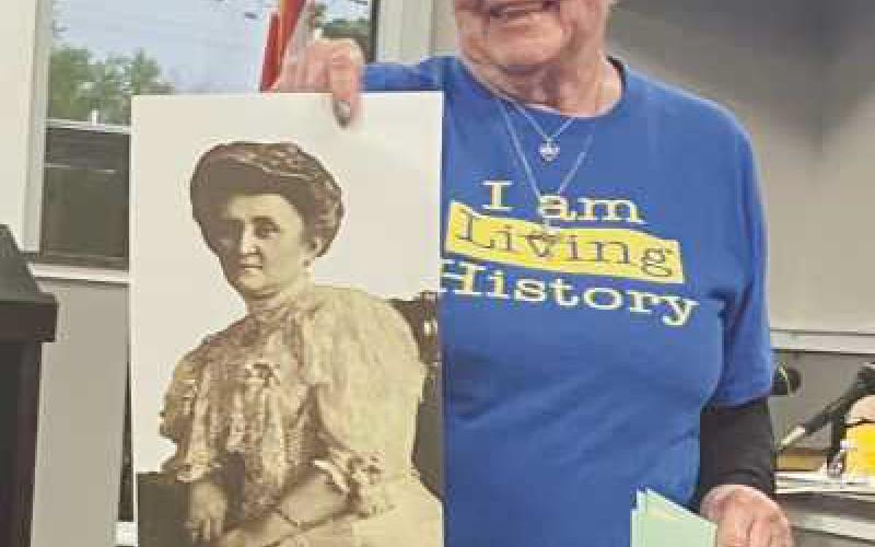 Judy Sikorski with a photo of Caroline Ross.