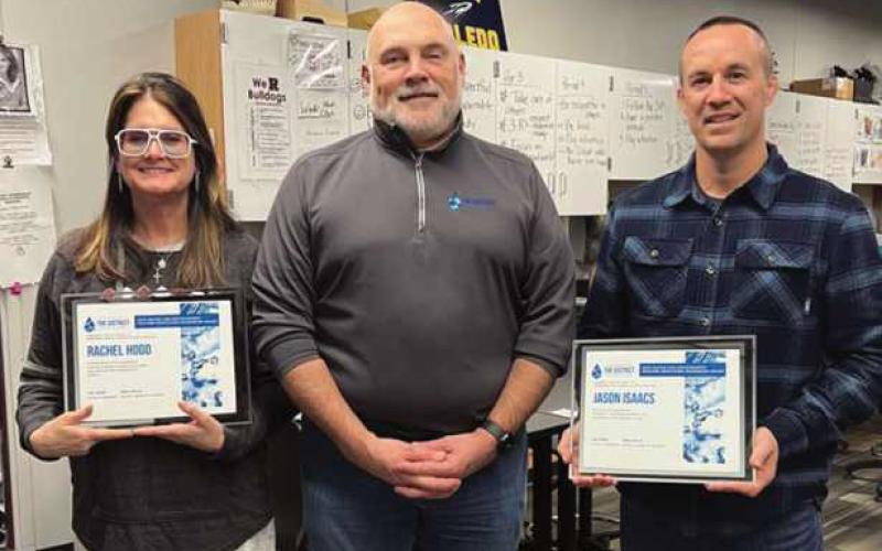 Rachel Hood, Rossford Junior High School science teacher; Doug Miller, District board chairman, and Jason Isaacs, Rossford High School science teacher.