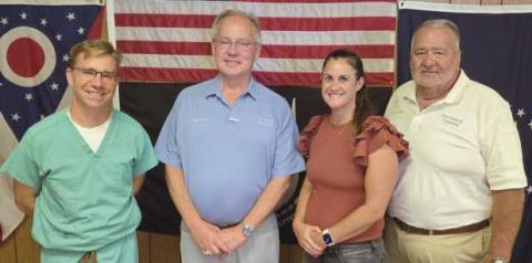 Perrysburg Township elected officials memorialize the last regular meeting of the board of trustees in the 1960s era building on Lime City Road. Future meetings will be held in the newly-constructed administration building located immediately south of the old building. From left: Trustee Jeffrey Moore, Trustee Bob Mack, Fiscal Officer Gretchen Welch and Trustee Joe Schaller.