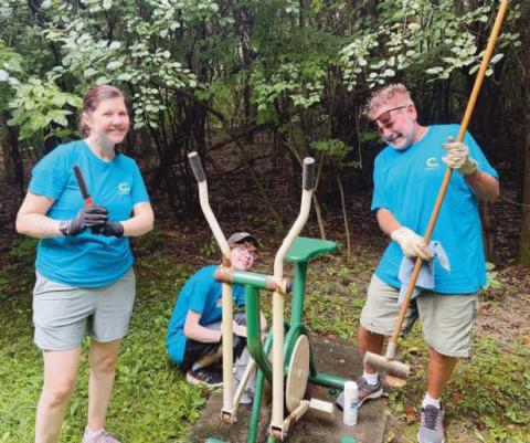 Members of the Shortridge family help clean up at Island View Park.