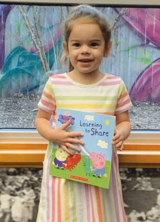 Rossford adds new member to 1,000 books club