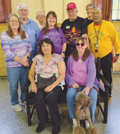Club members on the TREX bench they earned by recycling 1,000 pounds of pastic. The bench will be installed for public use in Perrysburg.