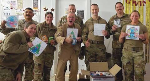 Every year, Rossford Elementary first graders send pictures and letters to local service personnel posted overseas. These pictures and letters were packaged at All Saints Church by the RHS Serving Our Soldiers Club. This photo was sent back from soldiers serving in Saudi Arabia.