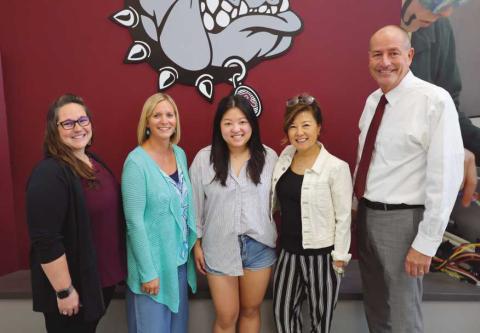 Family members of Dr. Lee with Rossford School officials.