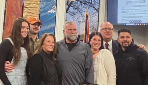 Public Works Superintendent Daryl Igo (center) with his family and Mayor MacKinnon (second from right).