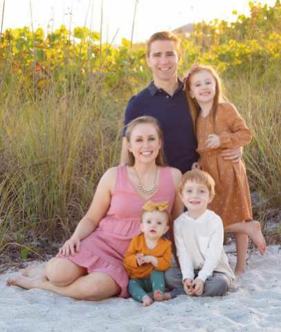 Dr. Moore with his wife, Dr. Manis, and their three children.