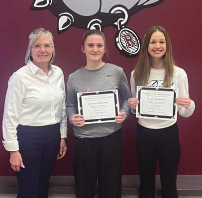 Left to right: Board President Jackie Huffman with Camryn Almester and Leah Matthews.