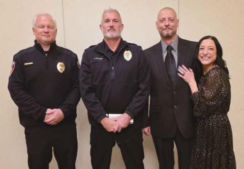 From left: Lieutenant Craig Revill, Chief Todd Kitzler, Sergeant Shawn Screptock and his wife, Candice Screptock.