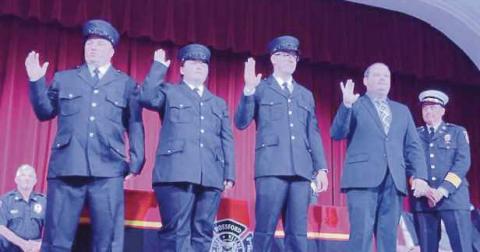 From left, Nick Frena, Allison Robinson , Michael Fox and Zach Bingham are sworn in.