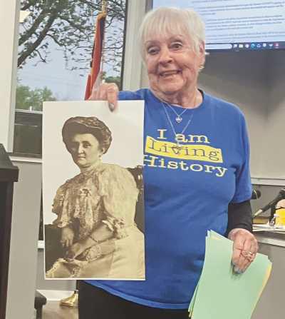 Judy Sikorski with a photo of Caroline Ross.