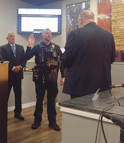 At the city council meeting, Officer Screptock was sworn in with his family, Mayor MacKinnon, Lt. Craig Revill and Chief Todd Kitzler.