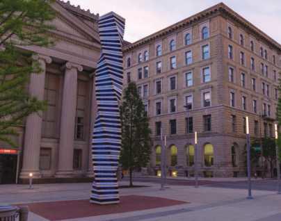 The Art Tatum Celebration Column by artist Cork Marcheschi, is a glowing, 27-foot spiraled column of powdercoated stainless steel and glass that represents the piano keys of the legendary jazz pianist, Art Tatum.