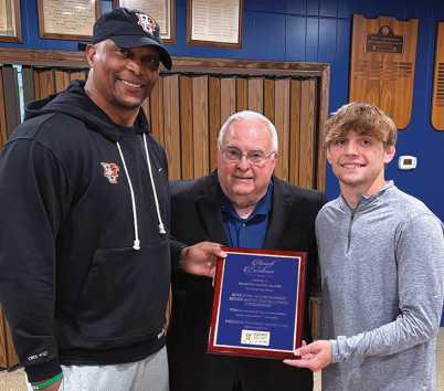 From left: Coach Eddie George, Freedom Township Men’s Club Representative Rick LaLonde and Marcus Blaze.