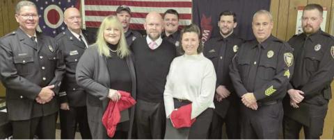 Back from left: Firefighter Todd Hager, Fire Captain Paul Weist, Firefighters Branden Abke and Sam Eiben, Police Sergeants Tyler Gearig and Scott Mezinger and Police Patrolman Andrew Watson. Front from left: Awardees Sarai Shaneck, Justin Bytner and Samantha Bytner.