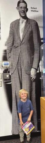 Bennett asked to have his photo taken in front of Robert Wadlow.