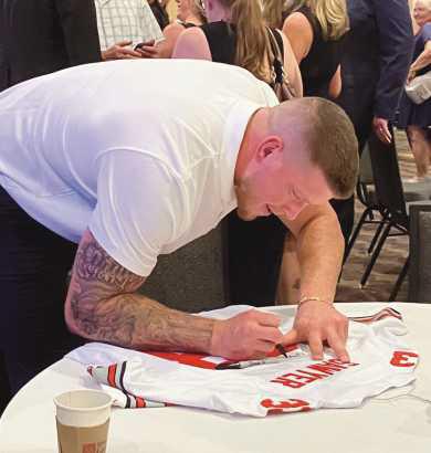 Jack Sawyer stayed for signatures and photos after speaking at the event.