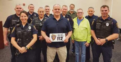 From left: Patrol Officer Chris Klewer, Patrol Officer Alicia Cryan, Patrol Officer Nick Owens, Sargeant Scott Mezinger, Lieutenant Dave Molter, retiring Deputy Chief Dave Nixon, Chief Matt Gazarek, Administrator Jon Eckel, Trustee Gary Britten, Lieutenant Jason Gladney and Patrol Officer Ryan Welch.