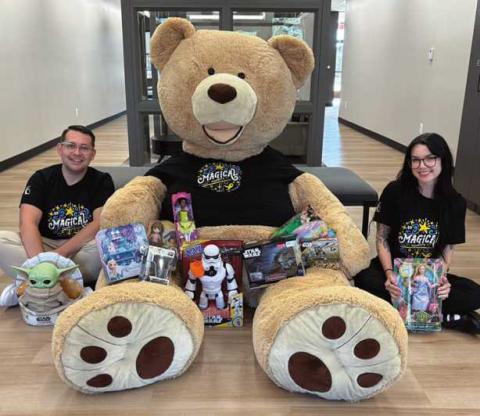 CCF employees Nick Parrino and Nicolette DeRespino pose with Freddy the Teddy and toy donations. Photo taken by Grace Alaska.