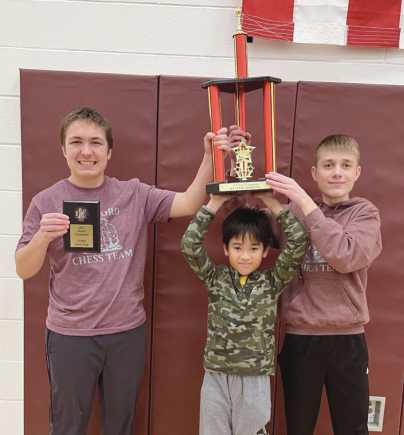 From left, Nathan Minor, Boa Nam Dang and Zeke Murtha with their first place K-8 section trophy.