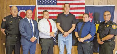 Four firefighters were hired to work for the fire department beginning June 23. From left are Fire Chief Tom Brice, new firefighters Ryan Shaffer, Sam Eiben, Jacob Cook and Alva Conger, and Deputy Chief Jim Rodriguez.