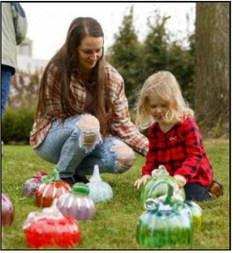 Museum visitors of all ages marvel at handblown glass pumpkins created by TMA studio artists during the museum’s annual Glass Harvest, Sept. 27-28. The pumpkins are available for sale.
