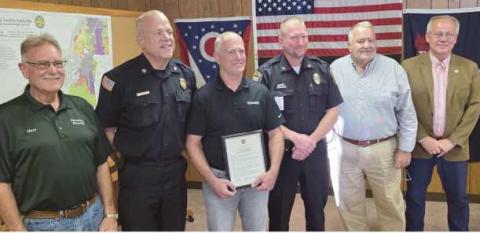 From left: Trustee Gary Britten, Fire Chief Tom Brice, Phil Eisel, Police Chief Matt Gazarek, Trustee Joe Schaller and Trustee Bob Mack.