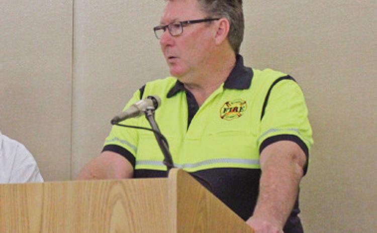 Bowling Green Fire Chief Bill Moorman leads a mock press conference, answering questions from several press agencies that participated in the exercises, including the Journal.