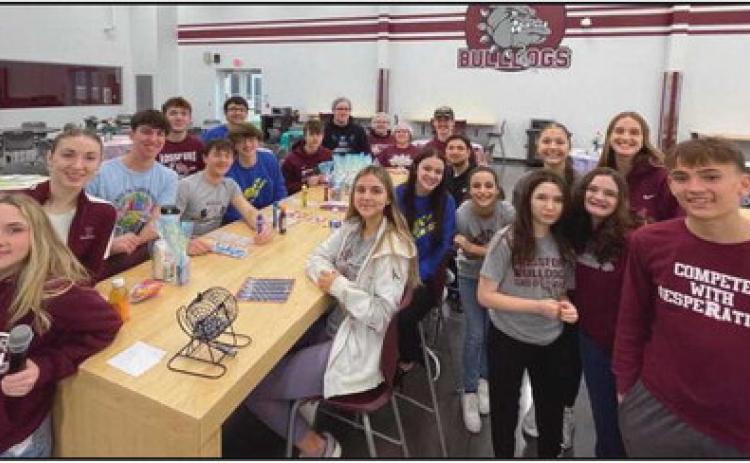 Students prepare to lead a game of bingo during the breakfast for area seniors.