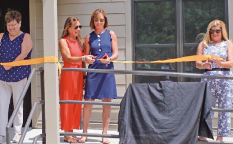 Members of the Sawyer family join Wood County Park District commissioners in dedicating the newly refurbished interpretive center at Sawyer Preserve on Lime City Road in Perrysburg Township. From left are Molly Sawyer Ludtke, park commissioner Sandy Wiechman, sisters Elizabeth Sawyer Biederman and Sally Sawyer Burns, and park commissioners Kim Rose and Tom Myers.