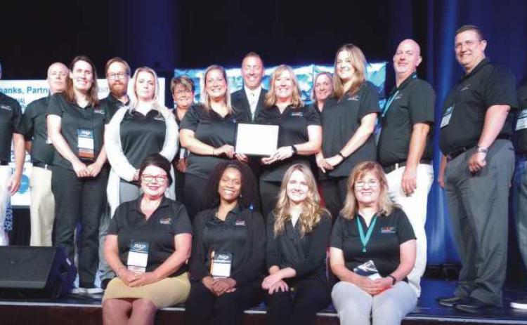 Penta staff and faculty celebrate their third Pacesetter School award.