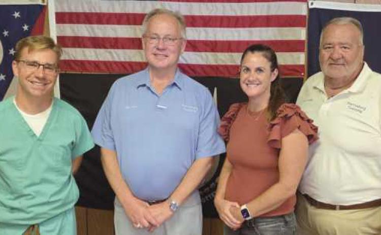 Perrysburg Township elected officials memorialize the last regular meeting of the board of trustees in the 1960s era building on Lime City Road. Future meetings will be held in the newly-constructed administration building located immediately south of the old building. From left: Trustee Jeffrey Moore, Trustee Bob Mack, Fiscal Officer Gretchen Welch and Trustee Joe Schaller.