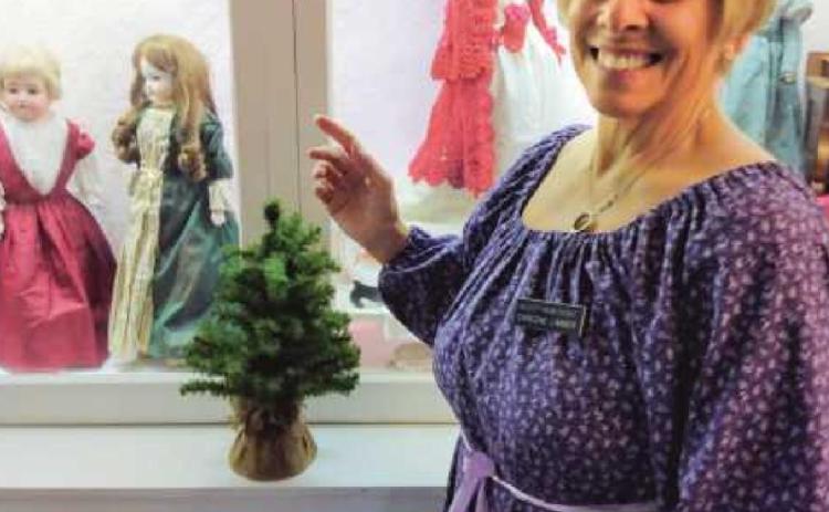 Rossford resident Darlene Limmer gives a tour of the toy room at the Wolcott House in Maumee.