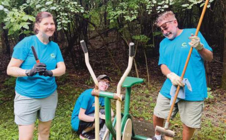 Members of the Shortridge family help clean up at Island View Park.