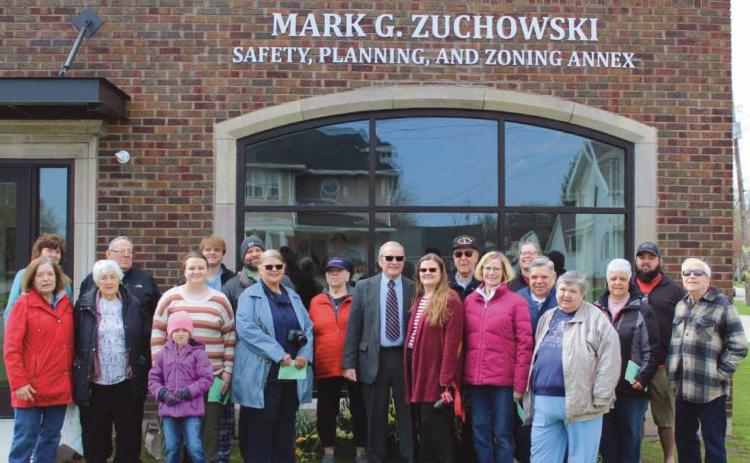 Building dedicated and tree planted honoring former ma