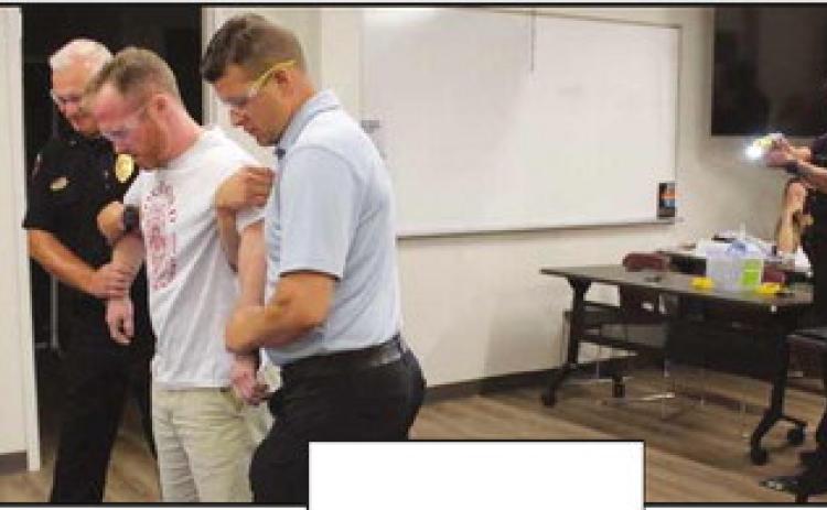 Citizens Police Academy learns about use of force and receives Taser demo