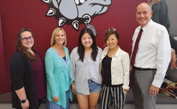 Family members of Dr. Lee with Rossford School officials.