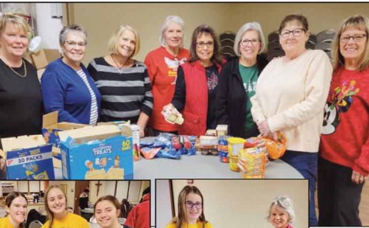 Volunteers prepare military care packages