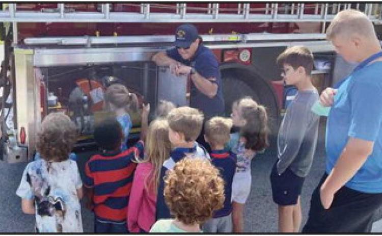 Rossford Fire Department participated in this years Safety Town, above, kindergarteners learn about the workings of a fire truck.