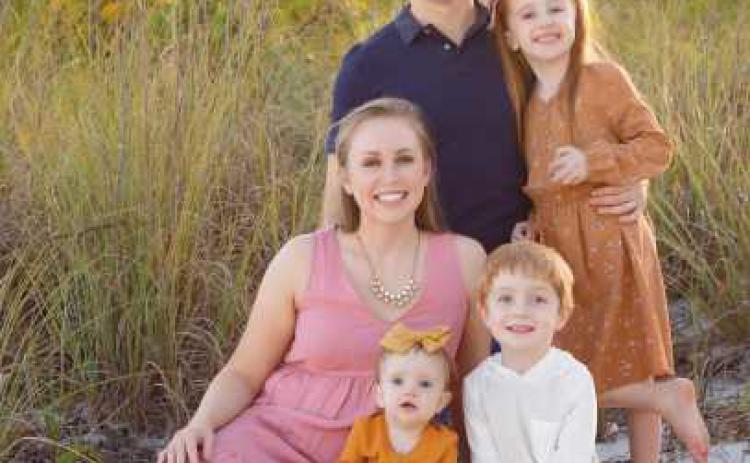 Dr. Moore with his wife, Dr. Manis, and their three children.
