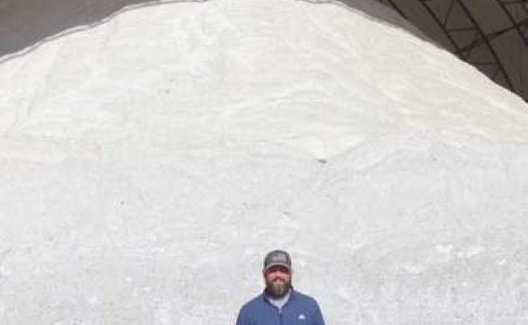Mark Bressler, ODOT highway management, stands in front of the fully stocked rock salt storage shed.