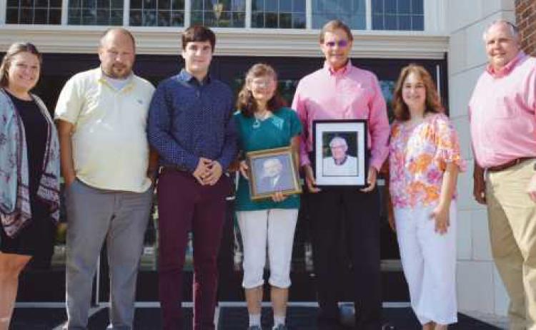 Above, from left: Kelsie Vaske, RHS guidance counselor; Ernest Shafer; Jonah Shafer; Marsha Wofter; Henry Werner Jr.; Heather Shafer and Tony Brashear, RHS principal.
