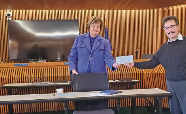 Commissioners present check for Big Fix countywide pet neutering program
