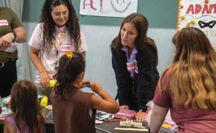 Owens Occupational Therapy Assistant student Jessie Materni works with Girl Scouts during the summer workshop. Photo provided by Owens Community College.