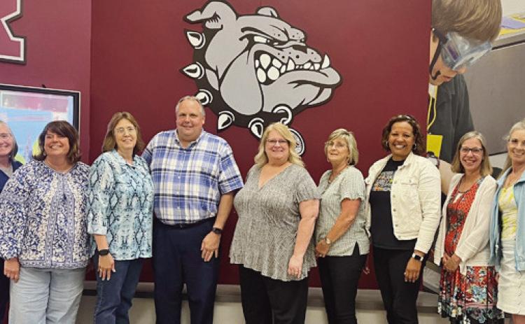 The school board recognized four retiring personnel. From left are board members Jackie Huffman and Emily Klocko; Sarah Stewart, custodian; Tony Brashear, RJSHS principal; Amy Gokey and Sherri Johns, RJSHS teachers, and board members Dawn Burks, Terry McKnight and Tiffany Densic.