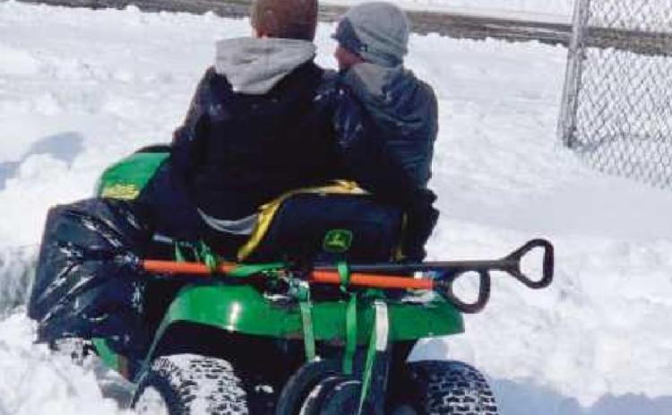 Kamden and his buddy on their way to shovel snow.