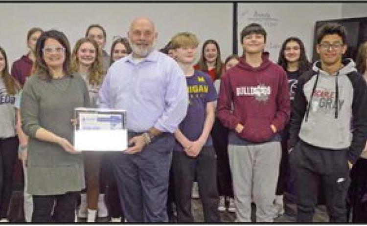 Grant recipient, Rachel Hood, teaches science at the junior high school. Above is Ms. Hood with her class and Doug Miller, a former Rossford Schools BOE member and the water and sewer district chairman of the board.